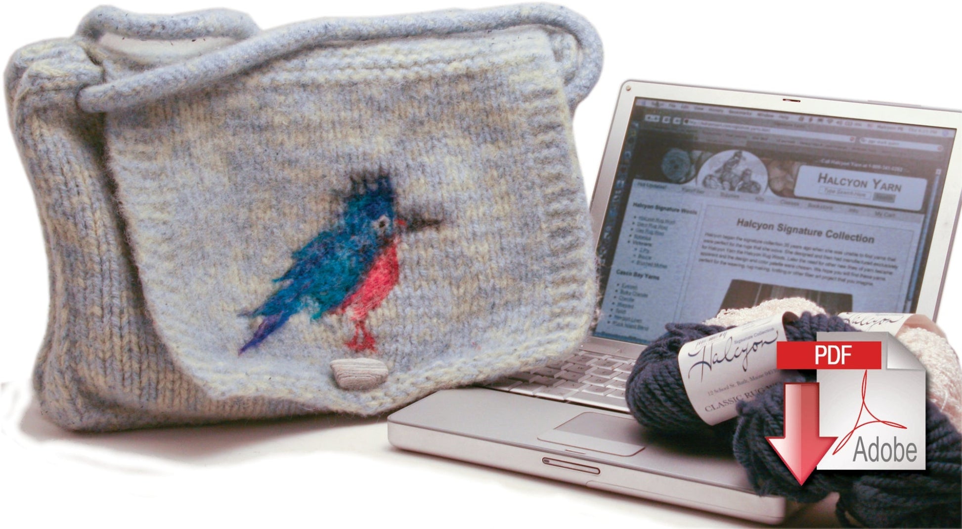 The Kingfisher Messenger Bag from Halcyon Yarn, featuring a unique blue and red bird design, rests atop an open white laptop. Beside the laptop, there is a bundle of yarn. A prominent red Adobe PDF download icon is superimposed on the image, pointing downward from the laptop screen. This personalized accessory adds charm to your workspace.