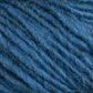 Close-up photo of blue textured Halcyon Geo Rug Wool from Caledonian Dye Works. The yarn fibers are visible, showing a slightly fuzzy and woolly appearance with detailed strands twisted together.