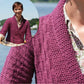 Close-up of a maroon knitted Wellfleet Jacket made from Nourmbega yarn, with a floral shirt underneath. Inset shows a person wearing the jacket, standing by a lake with a forested background, smiling and holding a boat's handrail. The jacket is by Twist Collective.