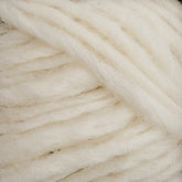 Close-up of thick, soft, white Lopi Alafoss Icelandic Wool Yarn by Berroco, Inc. intertwined loosely. The fibers appear fluffy and slightly fuzzy, showcasing the yarn's texture and natural color—perfect for crafting Icelandic pullovers.