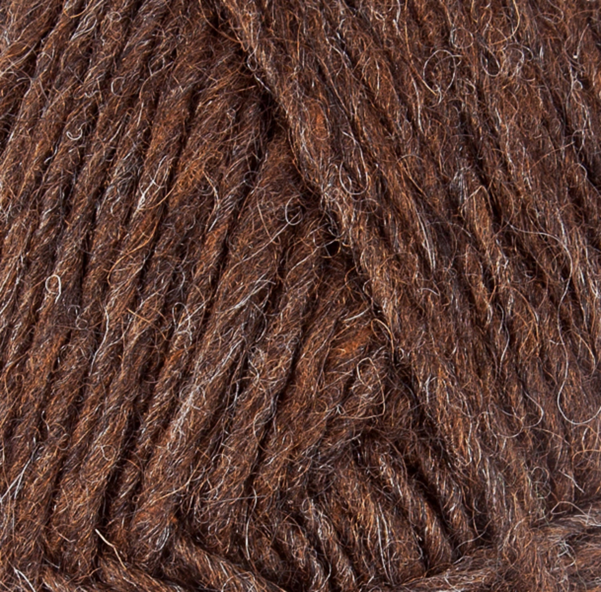 Close-up image of Lopi Alafoss Icelandic Wool Yarn by Berroco, Inc., showcasing brown yarn with mixed shades that reveal the textures of intertwined fibers. The thick, slightly rugged appearance includes hints of light and dark brown interwoven strands, making it perfect for crafting Icelandic pullovers.