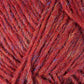 Close-up image of Lopi Alafoss Icelandic Wool Yarn by Berroco, Inc. in red with subtle interwoven blue and gold fibers creating a textured appearance. The thick, slightly fuzzy strands are reminiscent of the yarn used in Icelandic pullovers, with loose ends visible in some areas. The yarn appears to be bundled together in a tidy manner.