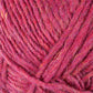 A close-up image of Berroco, Inc.'s Lopi Alafoss Icelandic Wool Yarn in red and pink, highlighting the texture and intricate details of the interwoven fibers. The yarn appears soft and slightly fuzzy, reminiscent of that used in traditional Icelandic pullovers, with various shades and hues giving it depth.