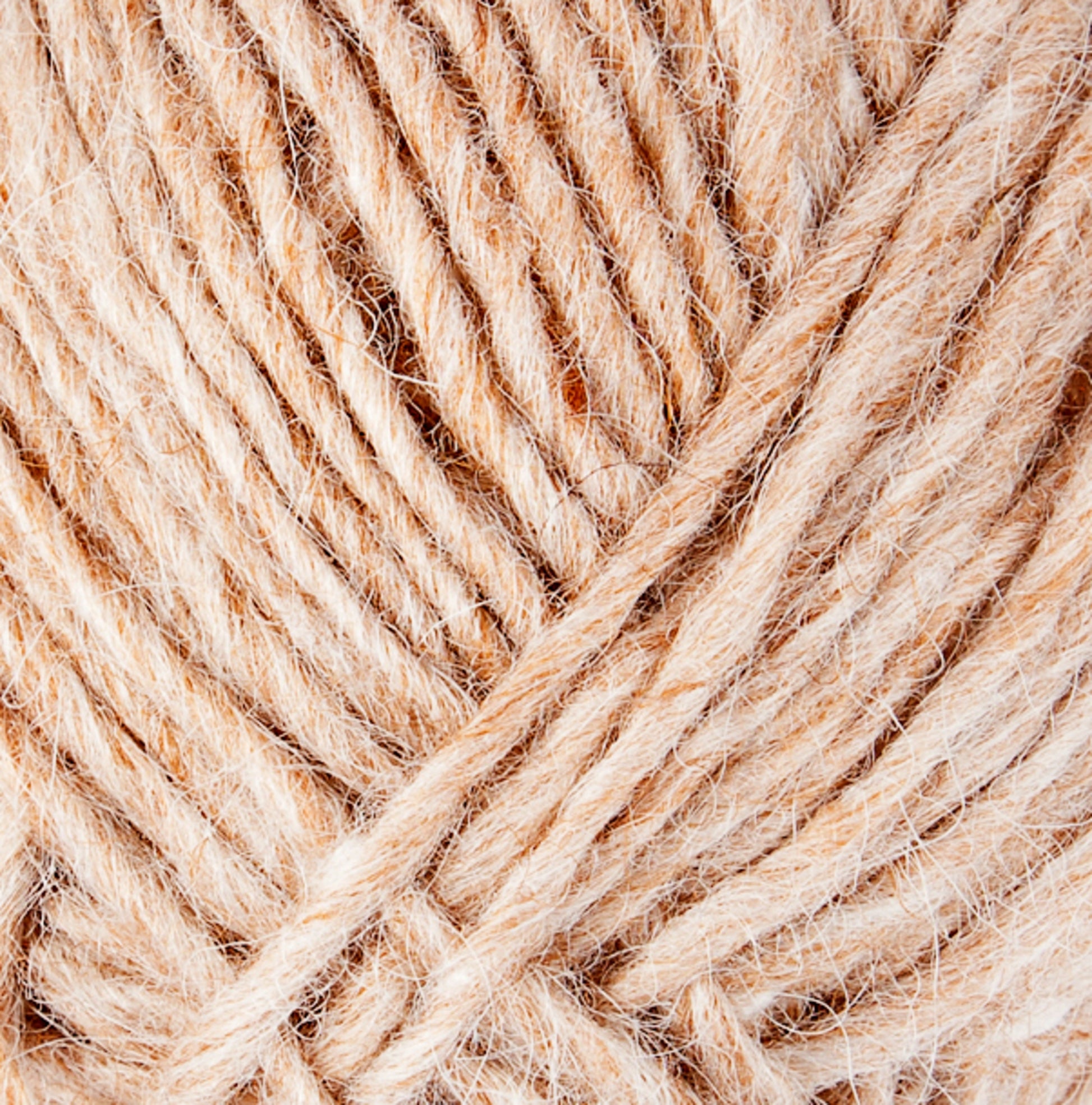 Close-up image of beige-colored wool yarn, showcasing the texture and intertwined fibers. The image highlights the softness and natural appearance of Lopi Alafoss Icelandic Wool Yarn by Berroco, Inc., with several strands twisted together. Ideal for crafting cozy Icelandic pullovers or felted mittens.