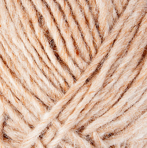 Close-up image of beige-colored wool yarn, showcasing the texture and intertwined fibers. The image highlights the softness and natural appearance of Lopi Alafoss Icelandic Wool Yarn by Berroco, Inc., with several strands twisted together. Ideal for crafting cozy Icelandic pullovers or felted mittens.