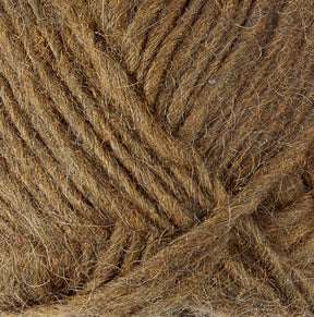 Close-up of a ball of brown Lopi Alafoss Icelandic Wool Yarn by Berroco, Inc., with visible fibers and textures, coiled neatly. The image highlights the intertwined strands and the soft, fuzzy texture of the material, indicating it may be suitable for knitting Icelandic pullovers or felted mittens.