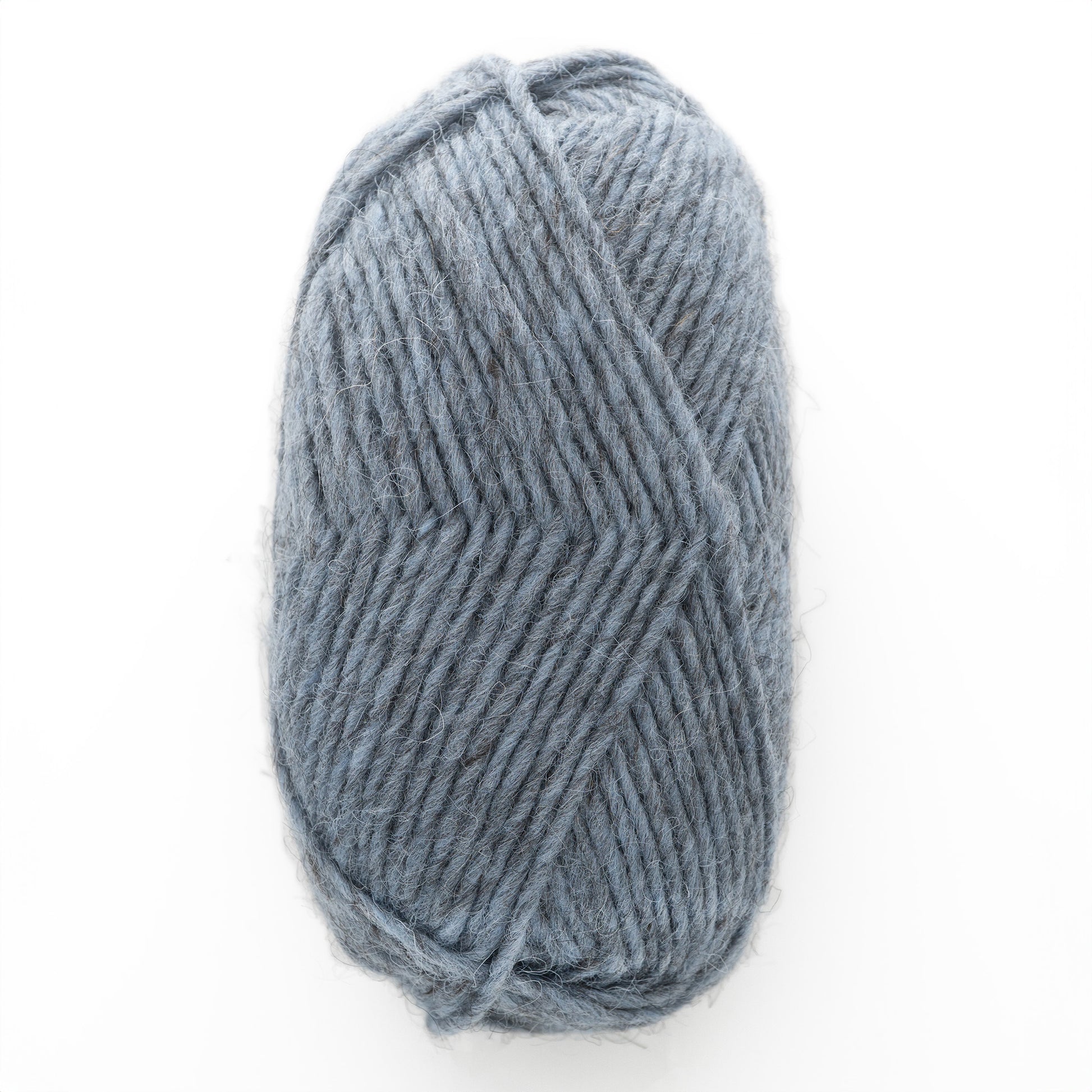 A skein of soft, grey Lopi Alafoss Icelandic Wool Yarn from Berroco, Inc. is neatly wrapped, showcasing its texture and fuzzy fibers. The yarn appears thick, ideal for knitting or crocheting warm items like scarves or Icelandic pullovers. It is set against a plain, white background.