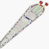 A pair of Peace Fleece Single-Pointed Wooden Knitting Needles, 10", from Harrisville Designs are displayed in a triangular paper sheath adorned with intricate floral patterns and text. The needles, featuring decorative red knobs, extend out from the open end of the sheath.