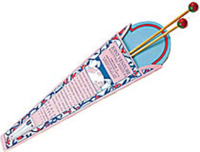 Displayed partially inside a colorful, triangular, patterned cardboard case is a set of Harrisville Designs' Peace Fleece Single-Pointed Wooden Knitting Needles, 10", featuring decorative ends in pink, blue, and red. The case includes text detailing the needles.