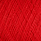 A close-up view of the vibrant red JaggerSpun Maine Line 3/8 Yarn on a large cone by Jagger Brothers, Inc. The texture is visible, showing intricate, crisscrossing threads of worsted spun yarns tightly wound together. The image highlights the rich color and the fine details of the soft medium-grade wool fibers.
