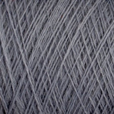 Close-up image of a spool of Jagger Brothers, Inc. JaggerSpun Maine Line 3/8 Yarn | Mini-cone. The grey yarn is tightly wound in diagonal overlapping layers, creating a textured pattern. The fibers are slightly fuzzy, giving it a soft appearance.