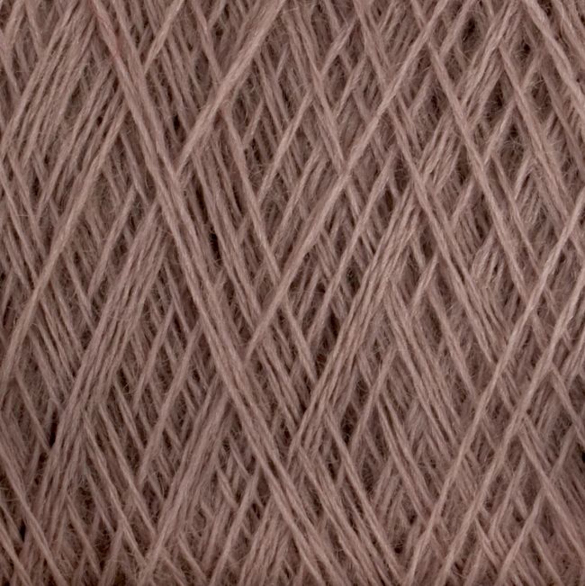 A close-up image of taupe-colored JaggerSpun Maine Line 3/8 Yarn | Mini-cone by Jagger Brothers, Inc. intricately wound in a crisscross pattern. The fibers appear soft and slightly fuzzy, forming a dense network of overlapping strands.