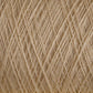 Close-up of a spool of beige JaggerSpun Maine Line 3/8 Yarn | Mini-cone from Jagger Brothers, Inc. The fibers are tightly wound and intricately crisscrossed, forming a textured pattern. The individual threads have a slightly fuzzy appearance, indicating a soft and delicate material, characteristic of Maine wool yarns.