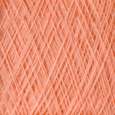 A close-up view of the JaggerSpun Maine Line 3/8 Yarn | Mini-cone fibers intersecting in a crisscross pattern, creating a textured surface. The Jagger Brothers, Inc. yarns are neatly arranged, showcasing the fine and soft threads that make up the material. The color is a warm, light shade of orange.