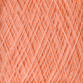 A close-up view of the JaggerSpun Maine Line 3/8 Yarn | Mini-cone fibers intersecting in a crisscross pattern, creating a textured surface. The Jagger Brothers, Inc. yarns are neatly arranged, showcasing the fine and soft threads that make up the material. The color is a warm, light shade of orange.