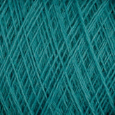 Close-up view of tightly wound teal-colored JaggerSpun Maine Line 3/8 Yarn on a large cone. The threads form a crisscross pattern, showcasing the texture and intricate fibrous details of the soft medium grade wool, crafted by Jagger Brothers, Inc.