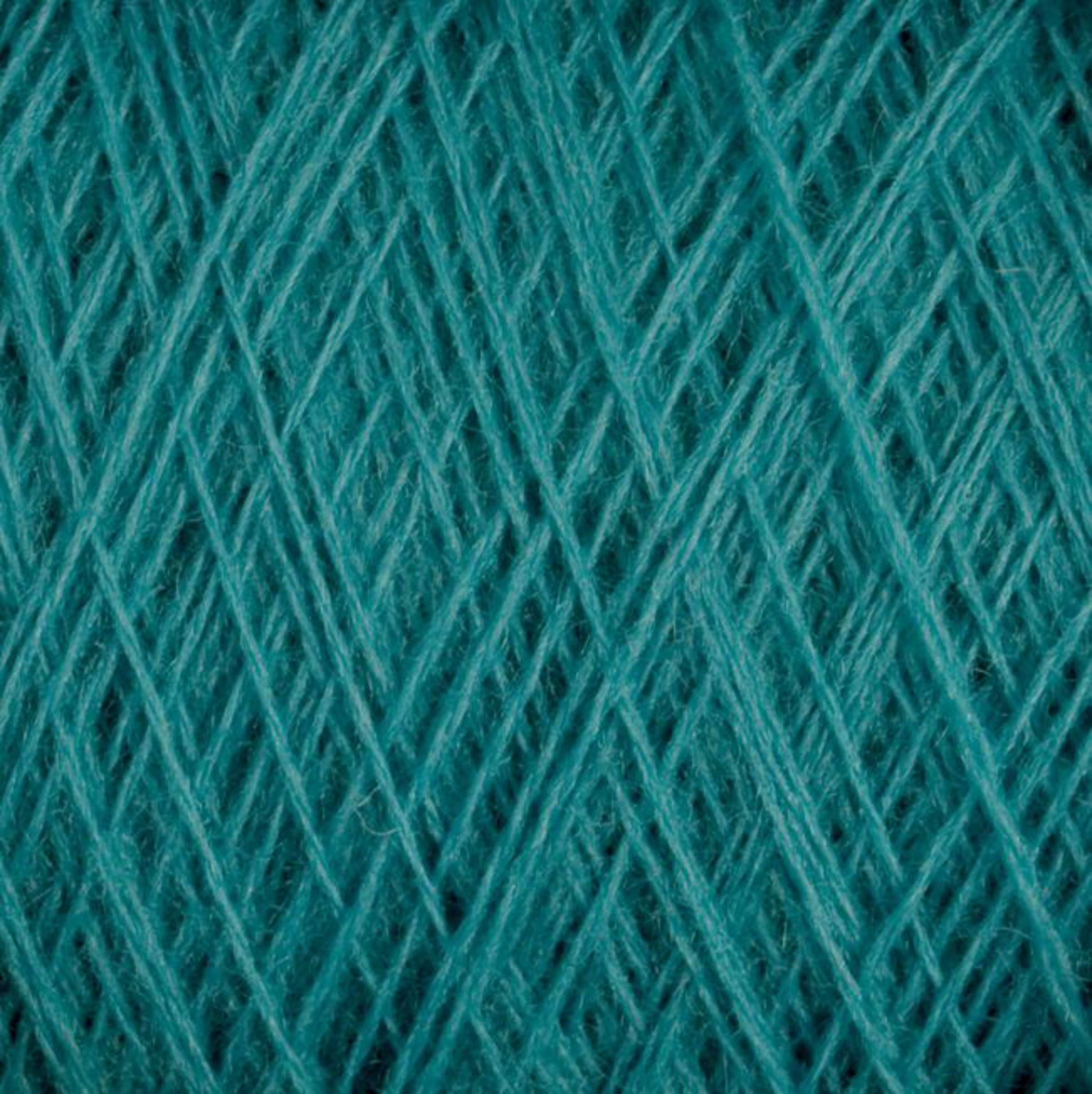 Close-up view of tightly wound teal-colored JaggerSpun Maine Line 3/8 Yarn on a large cone. The threads form a crisscross pattern, showcasing the texture and intricate fibrous details of the soft medium grade wool, crafted by Jagger Brothers, Inc.