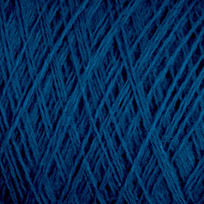 Close-up of dark blue JaggerSpun Maine Line 3/8 Yarn | Mini-cone by Jagger Brothers, Inc., showcasing its detailed texture. The strands of this worsted spun yarn are tightly wound, creating a crisscross pattern throughout the image. The rich and deep color enhances the visibility of the fibers and fine details.