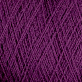 Close-up image of a ball of dark purple yarn. The intricate crisscrossing threads are tightly wound together, showcasing the soft texture and rich color typical of Jagger Brothers, Inc.'s JaggerSpun Maine Line 3/8 Yarn available in mini-cones.