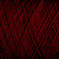 Close-up image of JaggerSpun Maine Line 3/8 Yarn | Mini-cone by Jagger Brothers, Inc., featuring its intricate, interwoven strands. The texture is soft with a deep, rich red color that fills the entire frame, highlighting the complexity and detail of the threads.