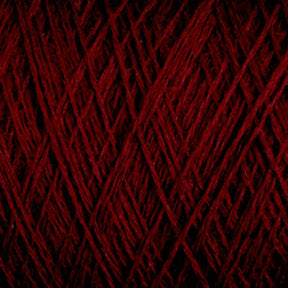 Close-up image of JaggerSpun Maine Line 3/8 Yarn | Mini-cone by Jagger Brothers, Inc., featuring its intricate, interwoven strands. The texture is soft with a deep, rich red color that fills the entire frame, highlighting the complexity and detail of the threads.