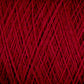 A close-up view of a spool of JaggerSpun Maine Line 3/8 Yarn | Mini-cone by Jagger Brothers, Inc. showcases the rich, red threads tightly wound in crisscross patterns, creating a textured surface. The vivid red color is evenly distributed throughout the worsted spun yarns.