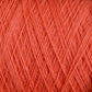 Close-up image of coral-colored JaggerSpun Maine Line 3/8 Yarn from Jagger Brothers, Inc. The tightly wound strands create a textured pattern across the frame, highlighting the yarn's smooth and fine appearance, typical of this soft medium grade wool.