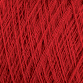 Close-up of a ball of red JaggerSpun Maine Line 2/8 Yarn from Jagger Brothers, Inc., showing a detailed and intricate pattern of tightly wound strands forming a dense, textured surface. The worsted spun yarn's individual fibers are visible, creating a rich and vibrant tapestry of crimson hues perfect for knitting or weaving projects.