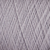 A close-up of the JaggerSpun Maine Line 2/8 Yarn mini-cone by Jagger Brothers, Inc. reveals the intricate crisscrossing pattern of its light gray fibers. The texture appears soft and slightly fuzzy, suggesting a possible wool or wool-blend material. Perfect for knitting, this worsted spun yarn offers a uniform and neat overall appearance.