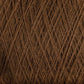 Close-up of JaggerSpun Maine Line 2/8 Yarn | Mini-cone by Jagger Brothers, Inc., tightly wound in a crisscross pattern, showcasing its texture and intricate arrangement. The brown worsted spun fibers appear soft and uniform, creating a rich, earthy tone throughout the image, perfect for knitting or weaving projects.