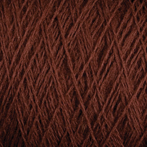 Close-up view of JaggerSpun Maine Line 2/8 Yarn in brown from Jagger Brothers, Inc., showcasing the intricate interwoven fibers and textures. The strands overlap in a detailed pattern, highlighting the natural and rich color of this worsted spun yarn, perfect for weaving or knitting projects.