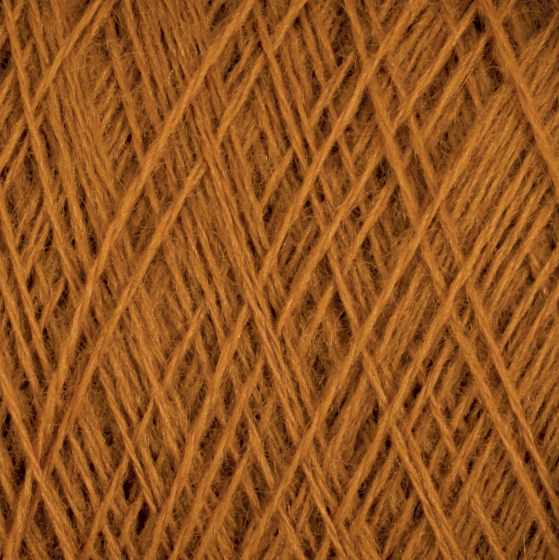 A close-up of Jagger Brothers, Inc.'s JaggerSpun Maine Line 2/8 Yarn | Mini-cone tightly wound in an intricate crisscross pattern. The texture reveals fine individual fibers, providing a detailed view of the weaving structure. The warm brown color dominates the entire frame.