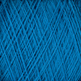 Close-up shot of the JaggerSpun Maine Line 2/8 Yarn | Mini-cone from Jagger Brothers, Inc. reveals tightly wound worsted spun yarn, forming a dense, crisscrossed pattern. The texture and strands are clearly visible, creating an intricate and repetitive design. The deep blue color gives this yarn a vibrant and rich appearance, perfect for knitting or weaving projects.