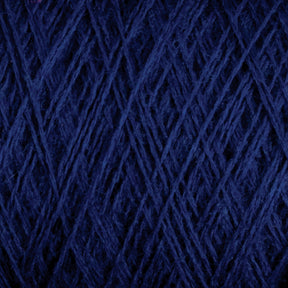 Close-up image of tightly wound, dark blue JaggerSpun Maine Line 2/8 Yarn | Mini-cone from Jagger Brothers, Inc. The texture is detailed, showcasing fibrous threads interwoven in a crisscross pattern, conveying a sense of the material’s softness and density.