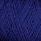 Close-up image of JaggerSpun Maine Line 2/8 Yarn | Mini-cone in blue by Jagger Brothers, Inc. The photo captures the intricate details of the tightly wound fibers, highlighting the texture and deep blue color of the yarn. The focus is on the crisscrossing strands, creating a pattern reminiscent of knitting throughout the image.