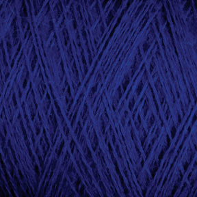 Close-up image of JaggerSpun Maine Line 2/8 Yarn | Mini-cone in blue by Jagger Brothers, Inc. The photo captures the intricate details of the tightly wound fibers, highlighting the texture and deep blue color of the yarn. The focus is on the crisscrossing strands, creating a pattern reminiscent of knitting throughout the image.