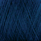 Close-up of JaggerSpun Maine Line 2/8 Yarn in dark blue from Jagger Brothers, Inc., showing tightly wound strands with intricate overlapping patterns and textures. The yarn has a slightly fuzzy appearance, ideal for knitting projects, enhancing its dense, rich hue.