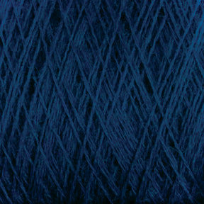 Close-up of JaggerSpun Maine Line 2/8 Yarn in dark blue, from Jagger Brothers, Inc., tightly wound in an overlapping crisscross pattern that forms a dense texture. The 27.5 micron worsted spun wool fibers appear soft and slightly variegated in shades of blue, ideal for both commercial and recreational knitters.