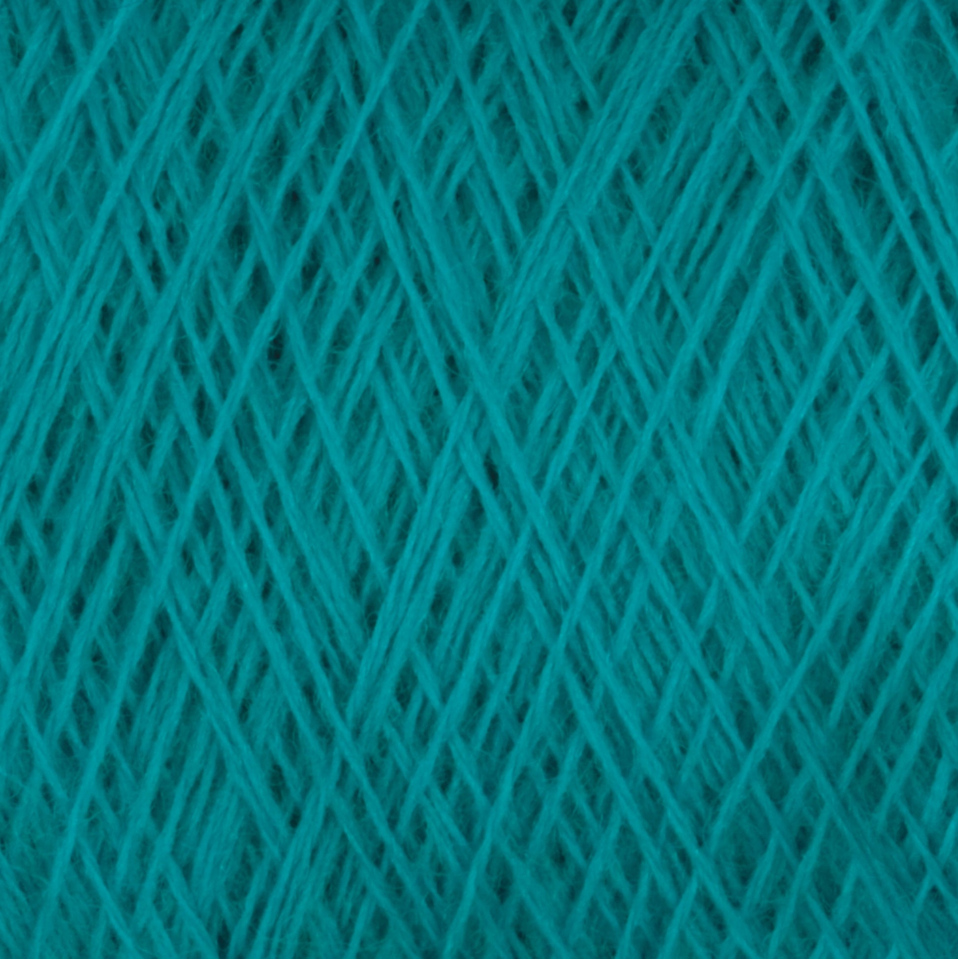 Close-up of JaggerSpun Maine Line 2/8 Yarn | Mini-cone by Jagger Brothers, Inc., showcasing intricately woven teal fibers in a dense, crisscrossing pattern. The texture appears soft and slightly fuzzy, highlighting the detailed threads and their overlapping structure, perfect for knitting projects.