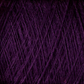 Close-up image of JaggerSpun Maine Line 2/8 Yarn Mini-cone by Jagger Brothers, Inc., showcasing a ball of dark purple, worsted spun yarn. The fibers are tightly wound, with visible strands crisscrossing each other, creating a textured and intricate pattern perfect for knitting or weaving projects.