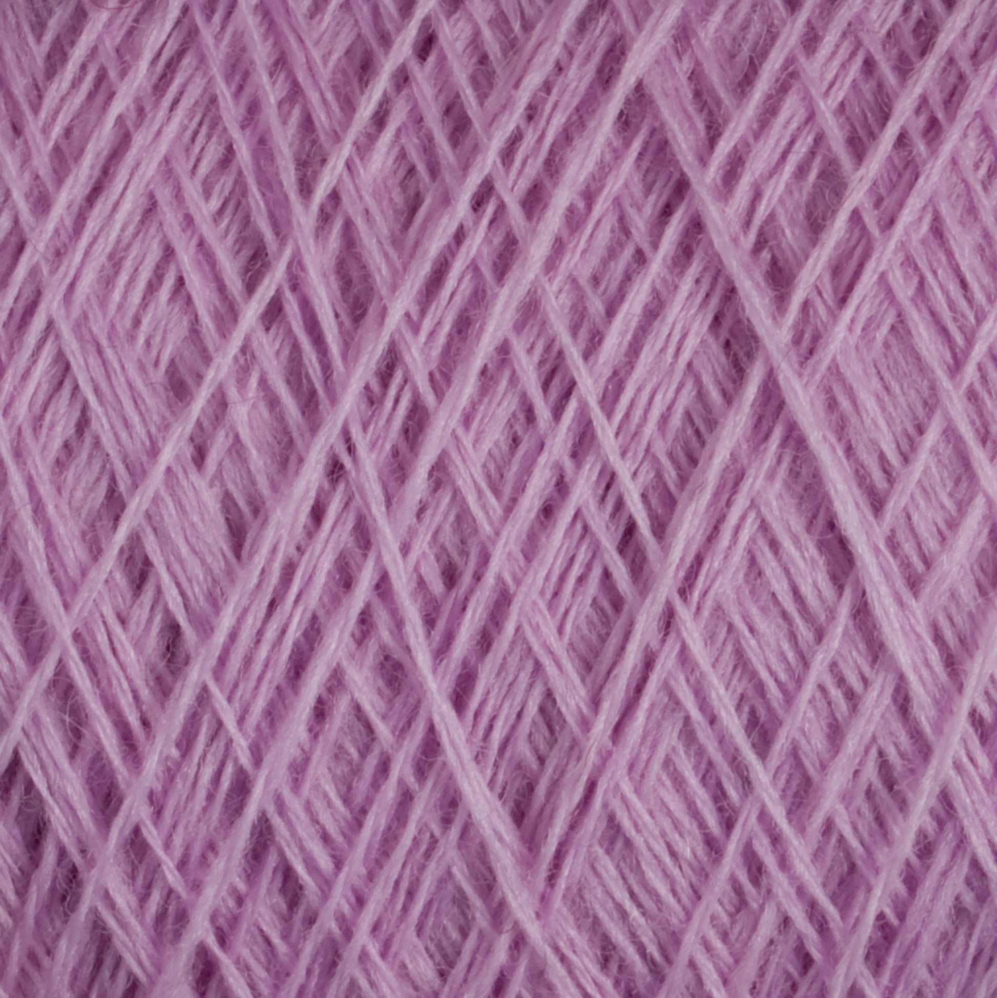 Close-up of a woven pattern featuring JaggerSpun Maine Line 2/8 Yarn from Jagger Brothers, Inc., showcasing pink, 27.5 micron worsted spun wool strands that create a textured surface with intersecting lines and soft fibers. The yarn maintains a consistent color and appears slightly fluffy, making it ideal for both commercial and recreational knitters.