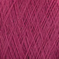 Close-up image of the JaggerSpun Maine Line 2/8 Yarn | Mini-cone by Jagger Brothers, Inc. in pink, showcasing tightly wound worsted spun fibers that form a textured, crisscross pattern. The meticulously arranged threads highlight the intricate and detailed structure, making it ideal for knitting projects.