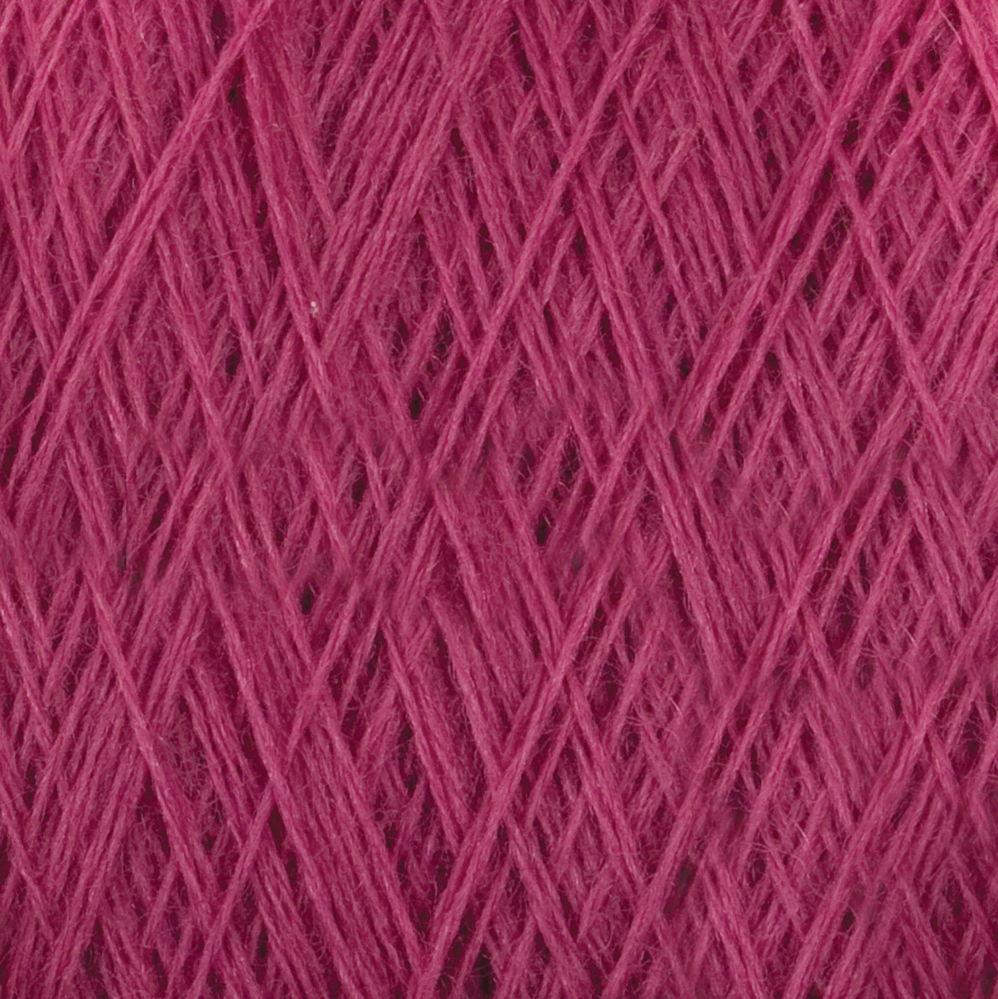 Close-up image of the JaggerSpun Maine Line 2/8 Yarn | Mini-cone by Jagger Brothers, Inc. in pink, showcasing tightly wound worsted spun fibers that form a textured, crisscross pattern. The meticulously arranged threads highlight the intricate and detailed structure, making it ideal for knitting projects.