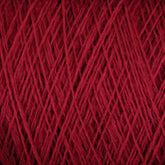 Close-up image of tightly wound JaggerSpun Maine Line 2/8 Yarn in dark red, showing its fibrous texture and overlapping strands, perfect for knitting or weaving. This mini-cone is brought to you by Jagger Brothers, Inc.