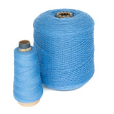 Two spools of Jagger Brothers' JaggerSpun Maine Line 2/8 Yarn sit side by side against a white background. The larger spool, cylindrical and significantly bigger than its cone-shaped counterpart, displays yarn neatly wound to showcase a rich blue color, ideal for commercial knitters.