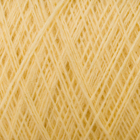 Close-up image of JaggerSpun Maine Line 2/20 Yarn | Mini-cone by Jagger Brothers, Inc., showcasing tightly wound yellow worsted spun yarns with visible crisscrossing fibers that highlight the texture and thickness of the medium grade wool. The photo emphasizes the intricate pattern created by the overlapping threads.