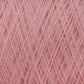 Close-up of JaggerSpun Maine Line 2/20 Yarn by Jagger Brothers, Inc., wound into a crisscross pattern, creating a textured surface with visible fibers. The soft appearance of this light pink medium-grade wool suggests it is ideal for knitting or crochet projects.