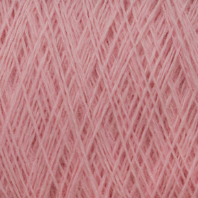 Close-up of JaggerSpun Maine Line 2/20 Yarn by Jagger Brothers, Inc., wound into a crisscross pattern, creating a textured surface with visible fibers. The soft appearance of this light pink medium-grade wool suggests it is ideal for knitting or crochet projects.