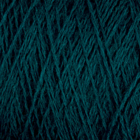 A close-up image of teal-colored JaggerSpun Maine Line 2/20 Yarn wound into a dense, textured ball or spool. The tight interweaving of the yarns from Jagger Brothers, Inc. creates an intricate pattern of crisscrossing strands. The texture and color are prominent, highlighting the softness and richness of the medium-grade wool.