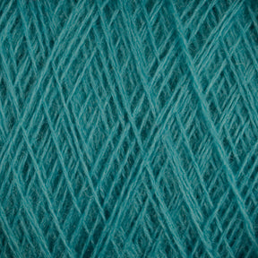 Close-up view of tightly woven, teal-colored JaggerSpun Maine Line 2/20 Yarn | Large Cone by Jagger Brothers, Inc., creating a textured and intertwined pattern. The image emphasizes the detailed fibers and crosshatching weave of the worsted spun yarns.